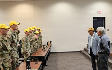 “Flight school class...don your hats!” Legacy Army Aviation leaders speak to new flight school students
