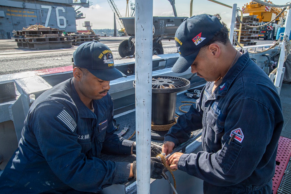 Ronald Reagan Sailors Conduct Life Raft Onload