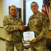 U.S. Army Lt. Col. Charles Baxter, Mississippi Army National Guard, receives the Meritorious Service Medal