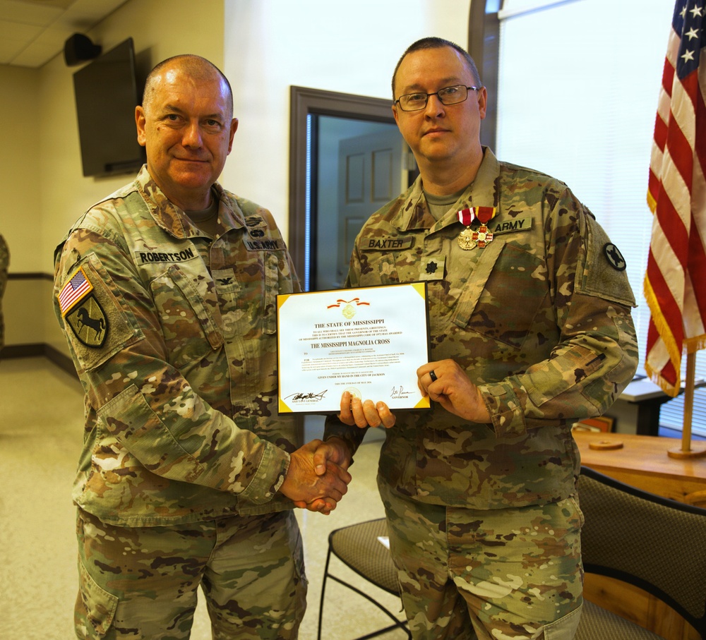 U.S. Army Lt. Col. Charles Baxter, Mississippi National Guard, receives the Mississippi Magnolia Cross