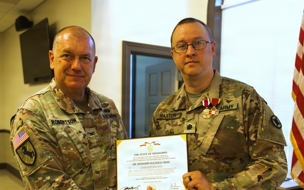 U.S. Army Lt. Col. Charles Baxter, Mississippi National Guard, receives the Mississippi Magnolia Cross