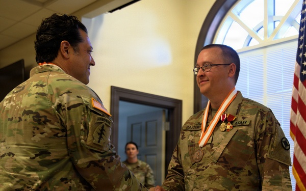 U.S. Army Lt. Col. Charles Baxter, Mississippi National Guard, receives the Bronze Order of Mercury award