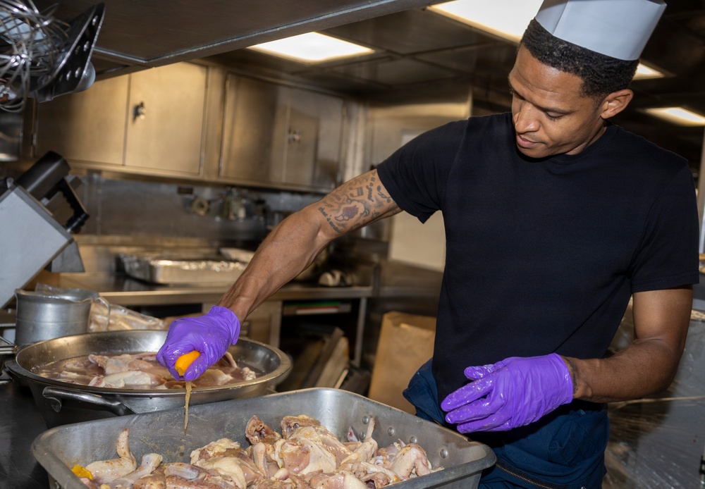 Delbert D. Black Prepares Meal for the Crew