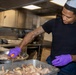 Delbert D. Black Prepares Meal for the Crew