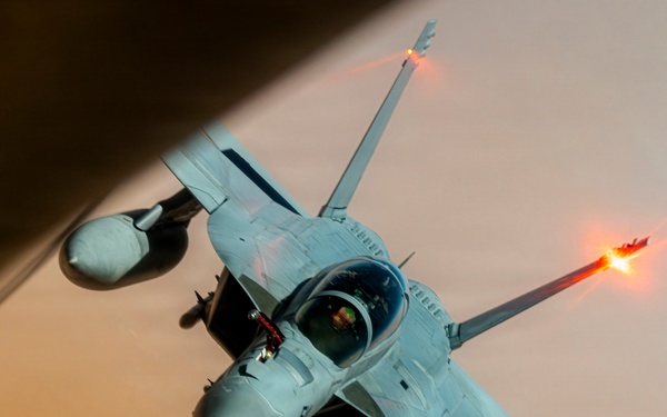 U.S. Air Force KC135 supports U.S. Navy F/A 18 during air refueling