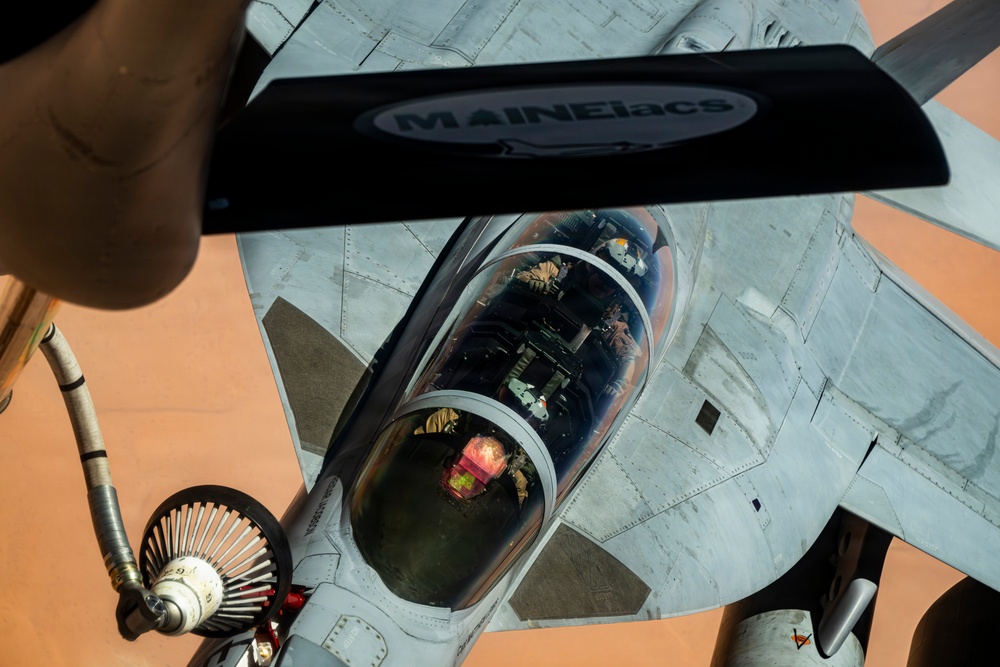 U.S. Air Force KC135 supports U.S. Navy F/A 18 during air refueling