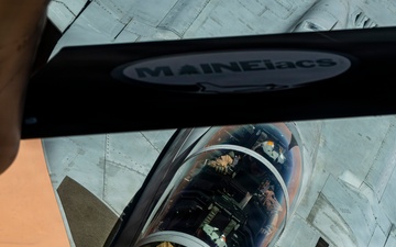 U.S. Air Force KC135 supports U.S. Navy F/A 18 during air refueling