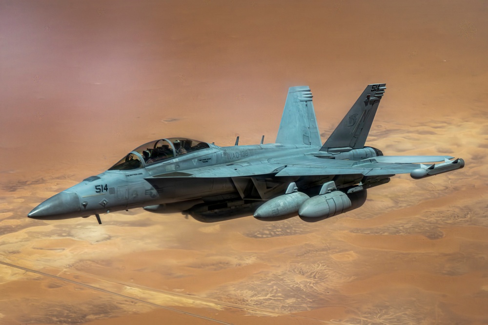 U.S. Air Force KC135 supports U.S. Navy F/A 18 during air refueling