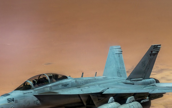 U.S. Air Force KC135 supports U.S. Navy F/A 18 during air refueling