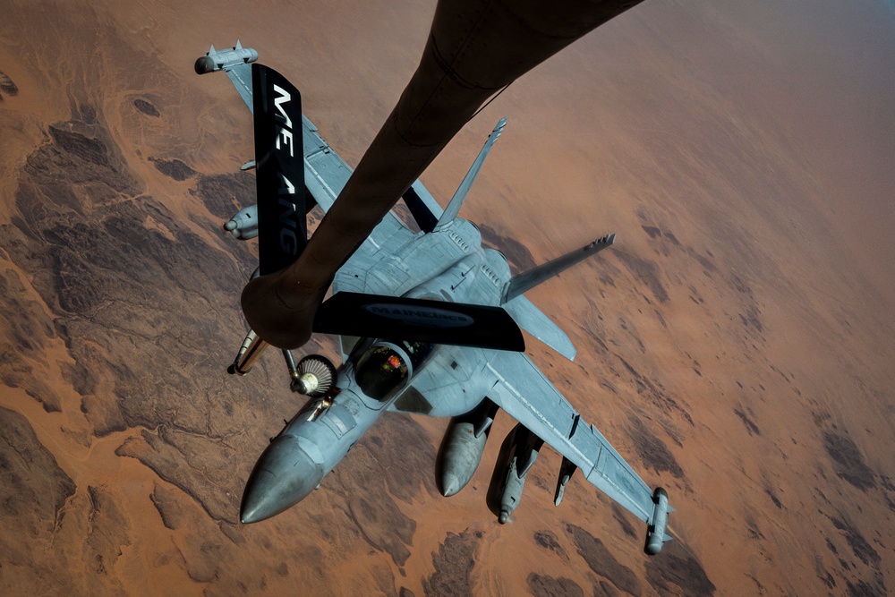 U.S. Air Force KC135 supports U.S. Navy F/A 18 during air refueling