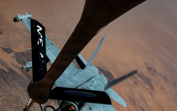 U.S. Air Force KC135 supports U.S. Navy F/A 18 during air refueling
