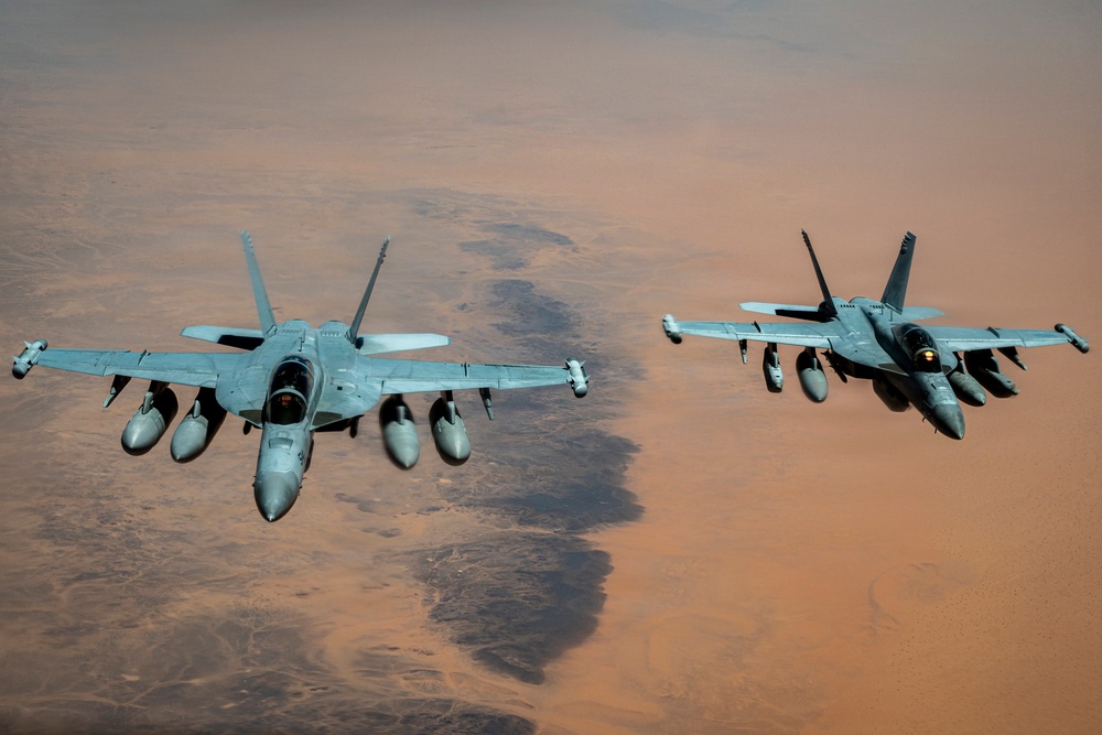 U.S. Air Force KC135 supports U.S. Navy F/A 18 during air refueling