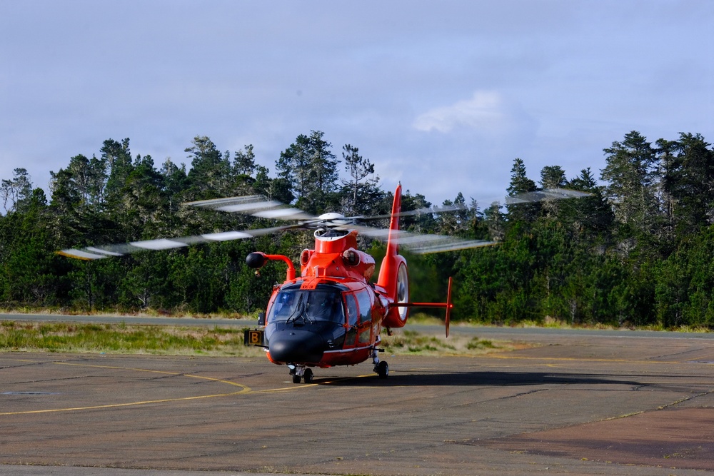 U.S. Coast Guard MH-65 Dolphin helicopter prepares for takeoff at little river  airport