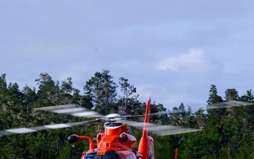 U.S. Coast Guard MH-65 Dolphin helicopter prepares for takeoff at little river  airport