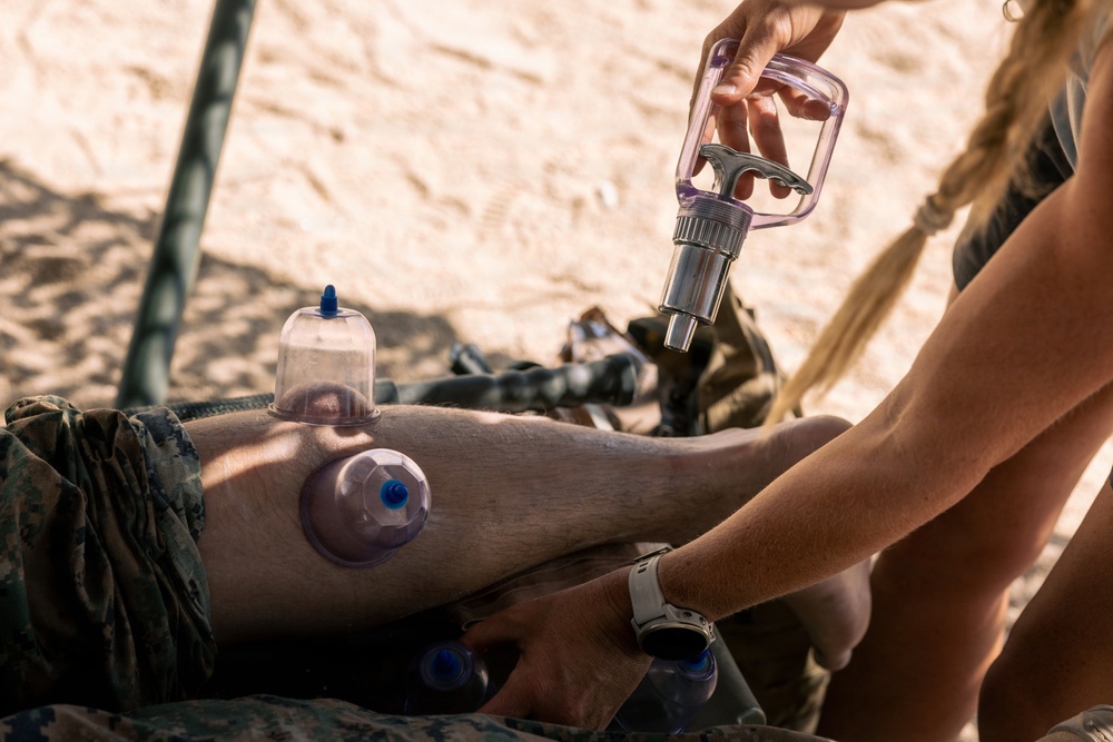 Marines with 2nd Bn., 1st Marines, visit the athletic trainer during AFX