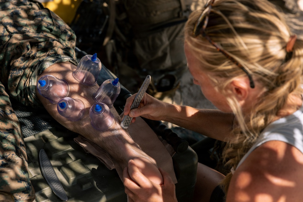 Marines with 2nd Bn., 1st Marines, visit the athletic trainer during AFX