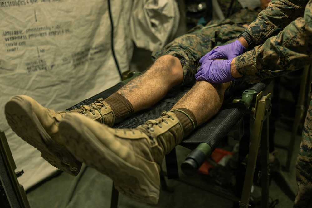 Marines with 2nd Bn., 1st Marines, visit the athletic trainer during AFX