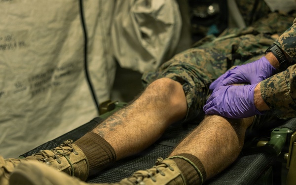 Marines with 2nd Bn., 1st Marines, visit the athletic trainer during AFX