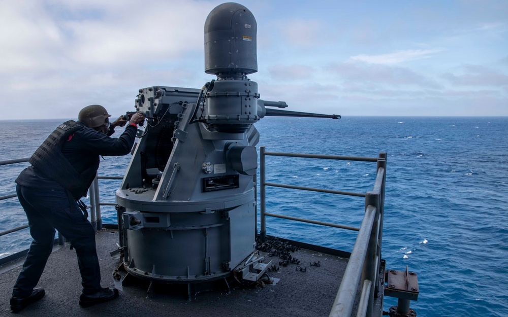 Aviation Ordnanceman Fires MK 38 - 25 mm Machine Gun System