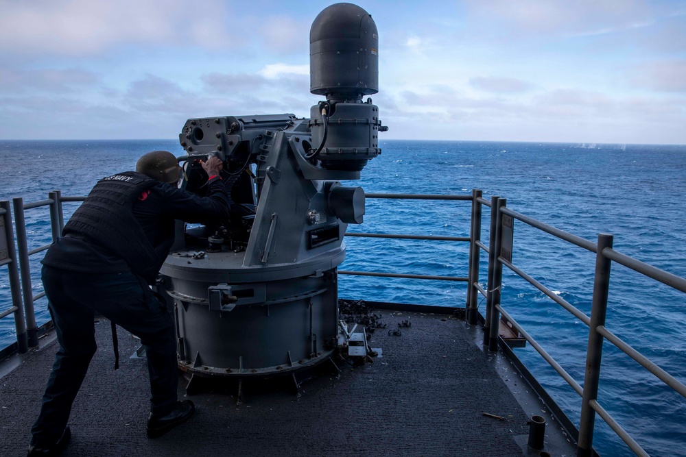 Aviation Ordnanceman Fires MK 38 - 25 mm Machine Gun System
