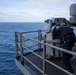 Aviation Ordnanceman Fires MK 38 - 25 mm Machine Gun System
