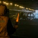 Navy Boatswain's Mate Signals to Landing Craft