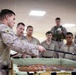 U.S. Marines and Sailors receive an operational order