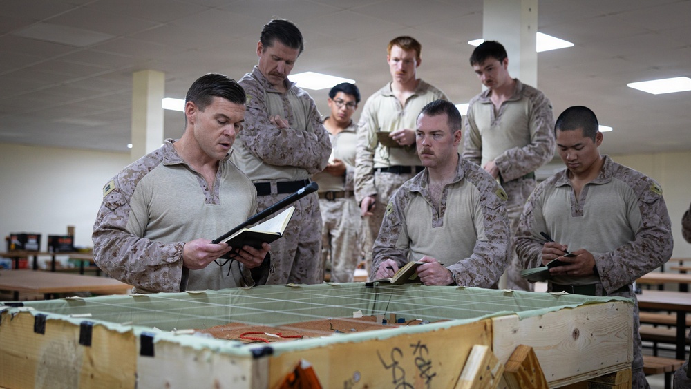U.S. Marines and Sailors receive an operational order