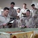 U.S. Marines and Sailors receive an operational order