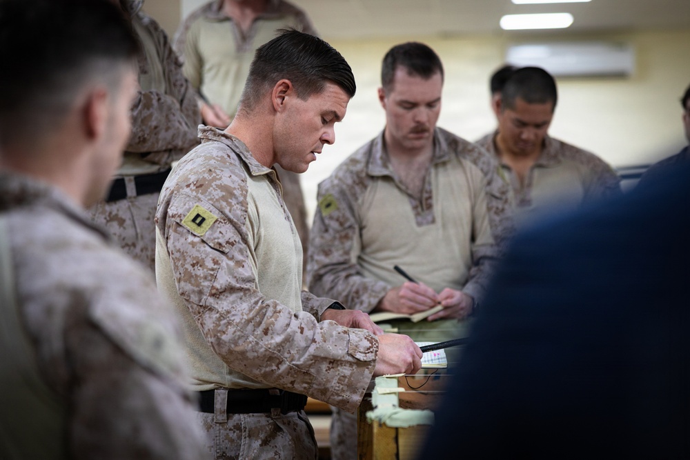 U.S. Marines and Sailors receive an operational order