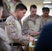 U.S. Marines and Sailors receive an operational order