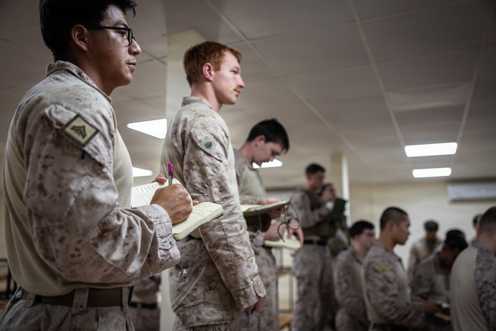 U.S. Marines and Sailors receive an operational order