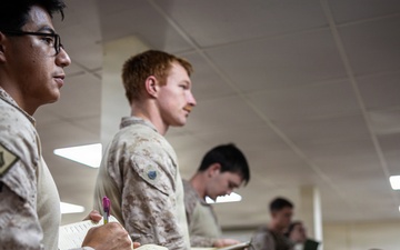 U.S. Marines and Sailors receive an operational order