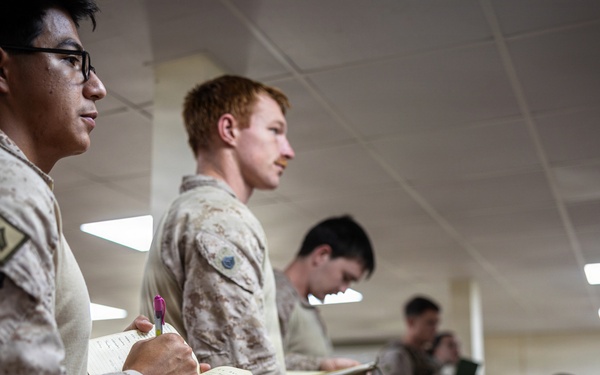 U.S. Marines and Sailors receive an operational order