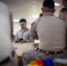 U.S. Marines and Sailors receive an operational order