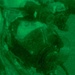 A night-vision captured image showing what appears to be a military or tactical operator wearing specialized equipment. The image is rendered entirely in green monochrome tones characteristic of night-vision optics. The subject appears to be wearing a helmet with mounted devices and a face mask or respirator.
