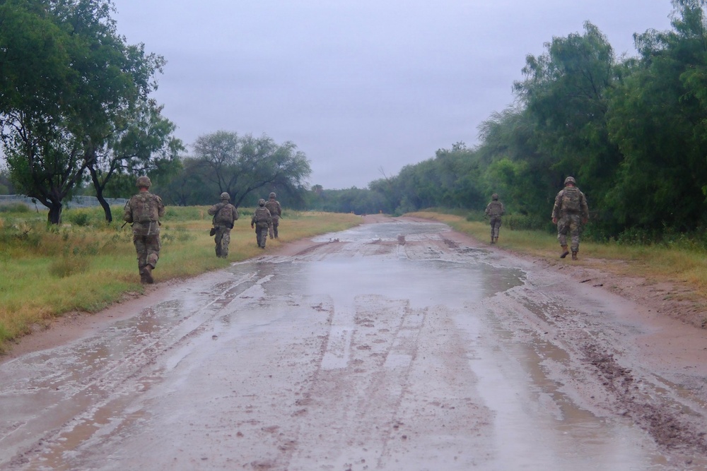 U.S Army Soldiers with the 744th Engineer Company conduct foot patrol along the southern border