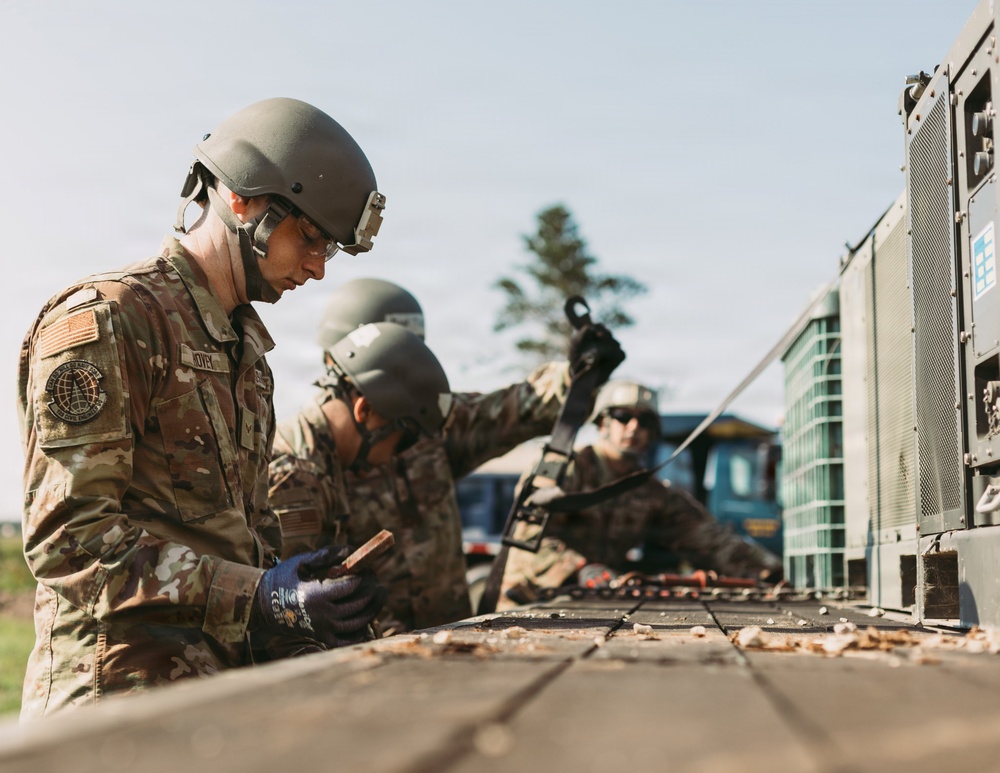 Airmen of the 131st Civil Engineering Squadron and the 139th Civil Engineering Squadron prepare a Forward Opearting Base