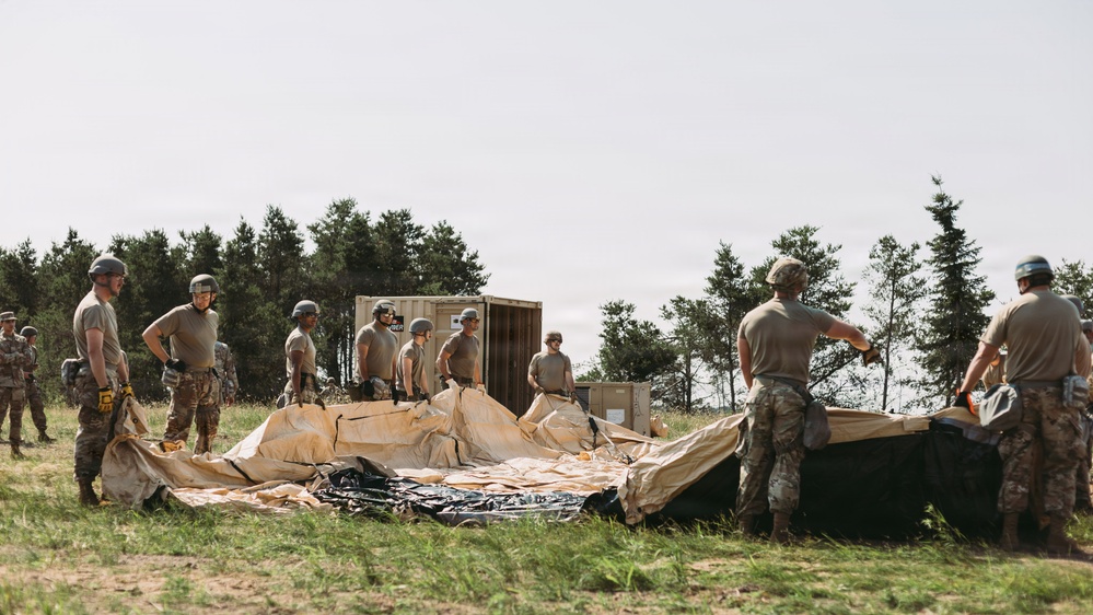 Airmen of the 131st Civil Engineering Squadron and the 139th Civil Engineering Squadron prepare a Forward Opearting Base