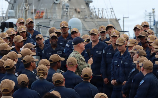 Rear Adm. Christopher Alexander, commander, Naval Surface Force Atlantic (SURFLANT), addresses the crew of USS Ted Stevens (DDG 128).