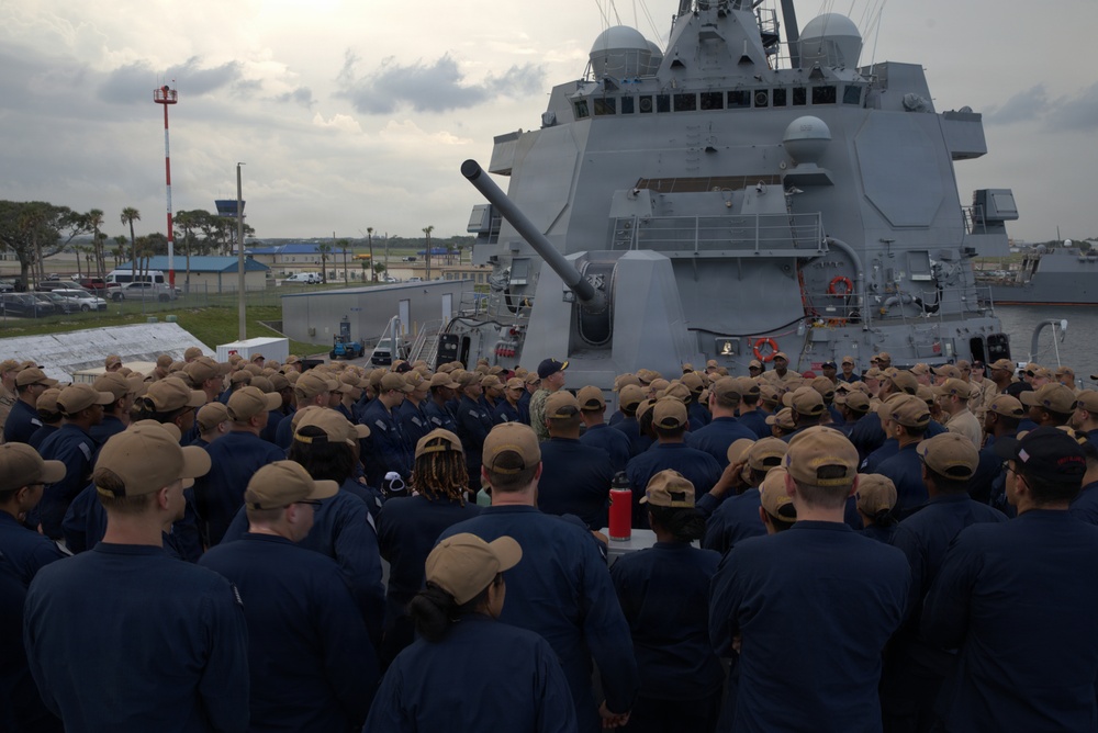 Rear Adm. Christopher Alexander, commander, Naval Surface Force Atlantic (SURFLANT), addresses the crew of USS Ted Stevens (DDG 128).