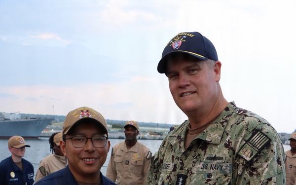 Rear Adm. Christopher Alexander, commander, Naval Surface Force Atlantic (SURFLANT), presents Electrician’s Mate Fireman Frank Velasquez-Ramirez with the Navy and Marine Corps Achievement Medal.
