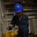 USS John C. Stennis (CVN 74) Sailor Conducts Maintenance