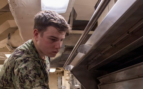 USS John C. Stennis (CVN 74) Sailor Conducts Maintenance
