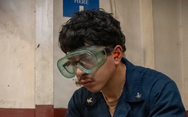 USS John C. Stennis (CVN 74) Sailor Conducts Maintenance