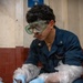 USS John C. Stennis (CVN 74) Sailor Conducts Maintenance