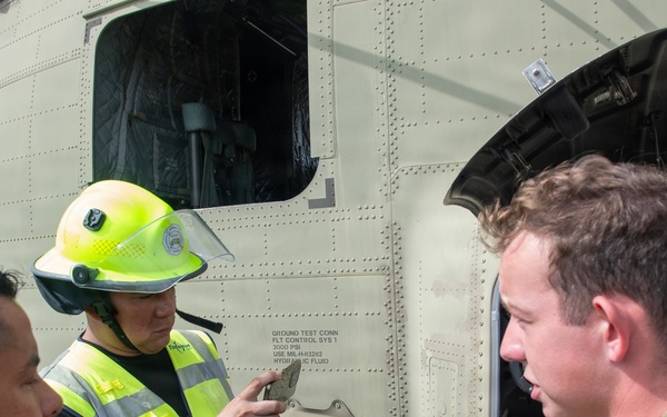 Panamanian firefighters receive CH-47 orientation during PANAMAX26