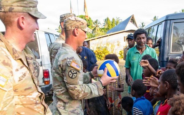 .S. Army Soldiers donate toys, musical instruments, and literature material to the youth of a local village during Tamiok Strike 26