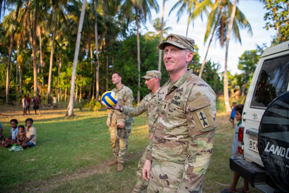 U.S. Army Soldiers donate toys, musical instruments, and literature material to the youth of a local village during Tamiok Strike 26