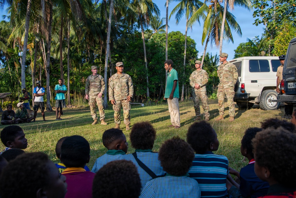 U.S. Army Soldiers donate toys, musical instruments, and literature material to the youth of a local village during Tamiok Strike 26